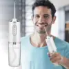 جهاز تنظيف الفم متعدد الرؤوس لنفس منتعش وأسنان نظيفة - Smart Oral Cleaner with Multiple Nozzles for Maximum Freshness